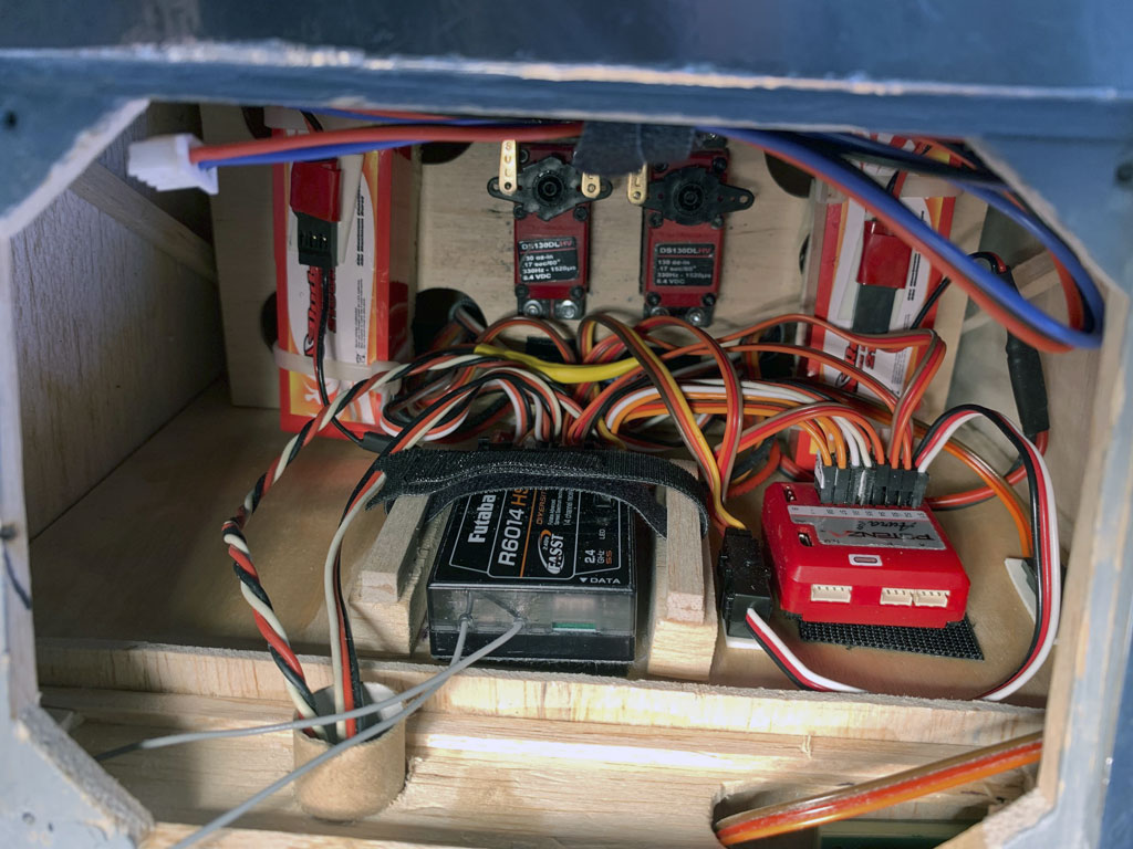 Close up photo of Hostetler quarter scale Cessna 195 radio installation with ProModeler servos