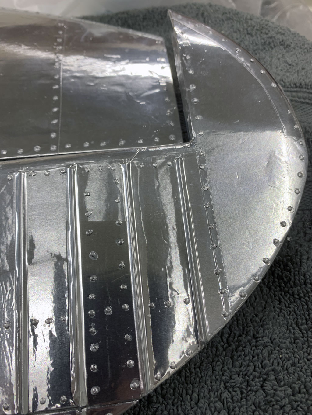Close up photo of the stabs detailed with rivet heads and covered in Flite-Metal for a Hostetler quarter scale Cessna 195 model