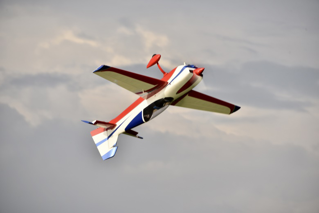 Photo of an RC Skywing 116-in Extra NG inverted in a Harrier showing a good bit of down elevator deflection