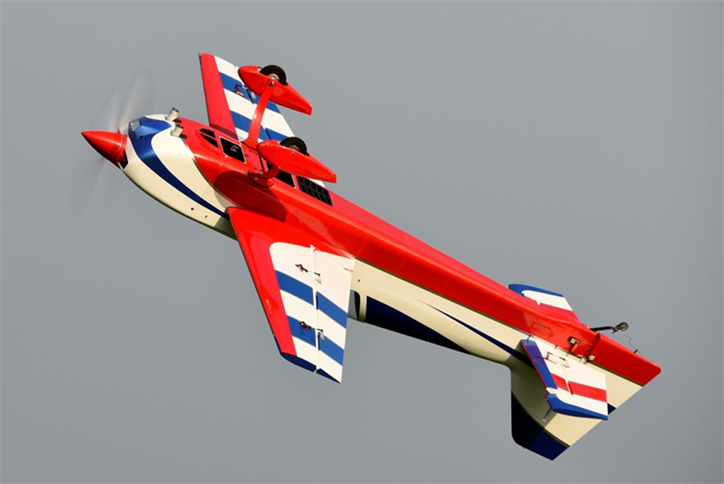 Wide angle photo of RC Skywing 116in Extra NG semi-inverted knife edge show pass