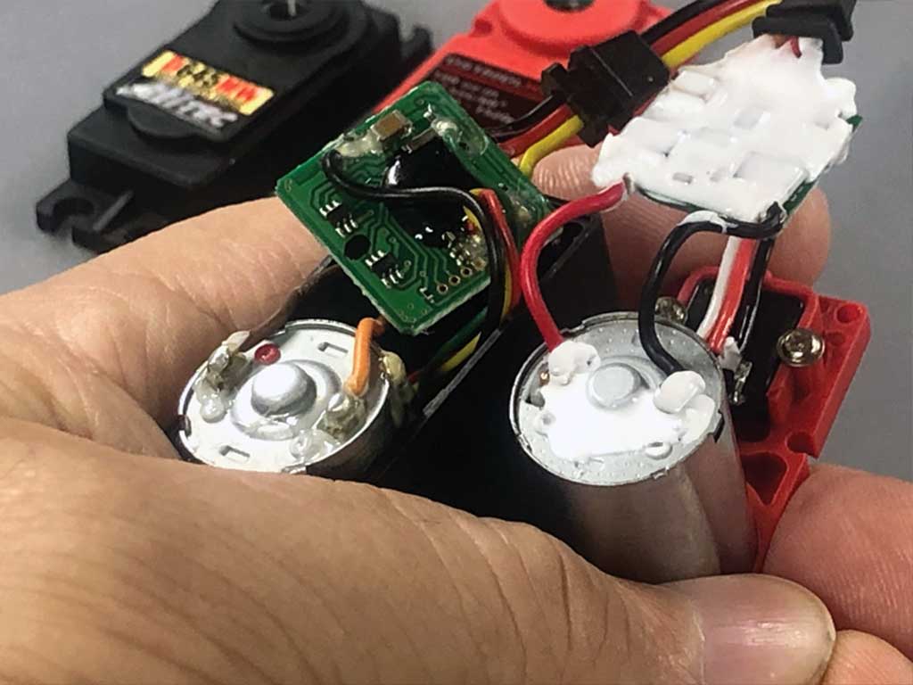 Close up of both Hitec D45MW and ProModeler DS180DLHV motors and PCBs