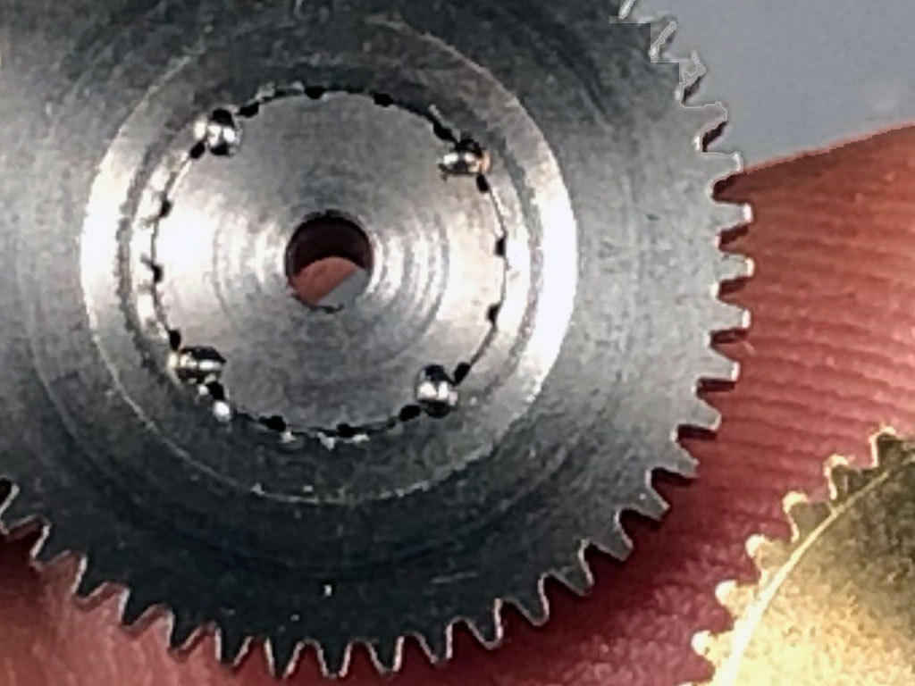 Hand held extreme close up of the four spot welds of a ProModeler #6/7 combo gear