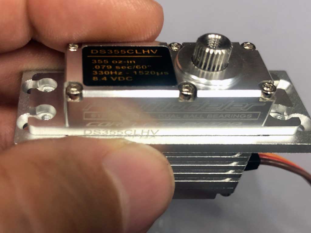 Close up of a miniclass servo fitted into a ProModeler M2S mini-to-standard mount.