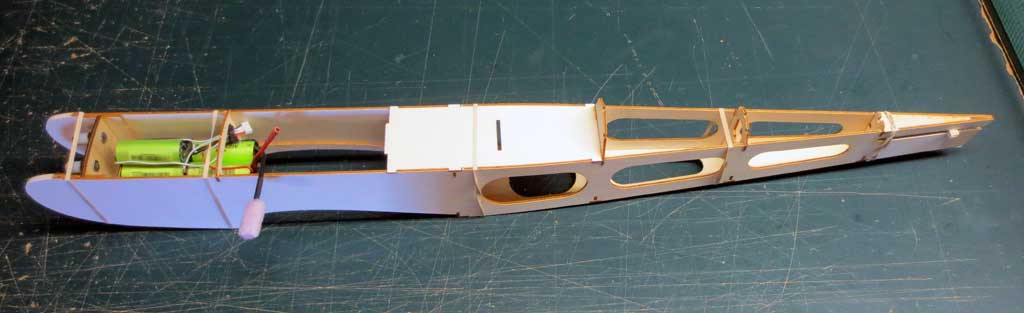 Test fitting the battery pack within the SIG Four-Star 40 fuselage.
