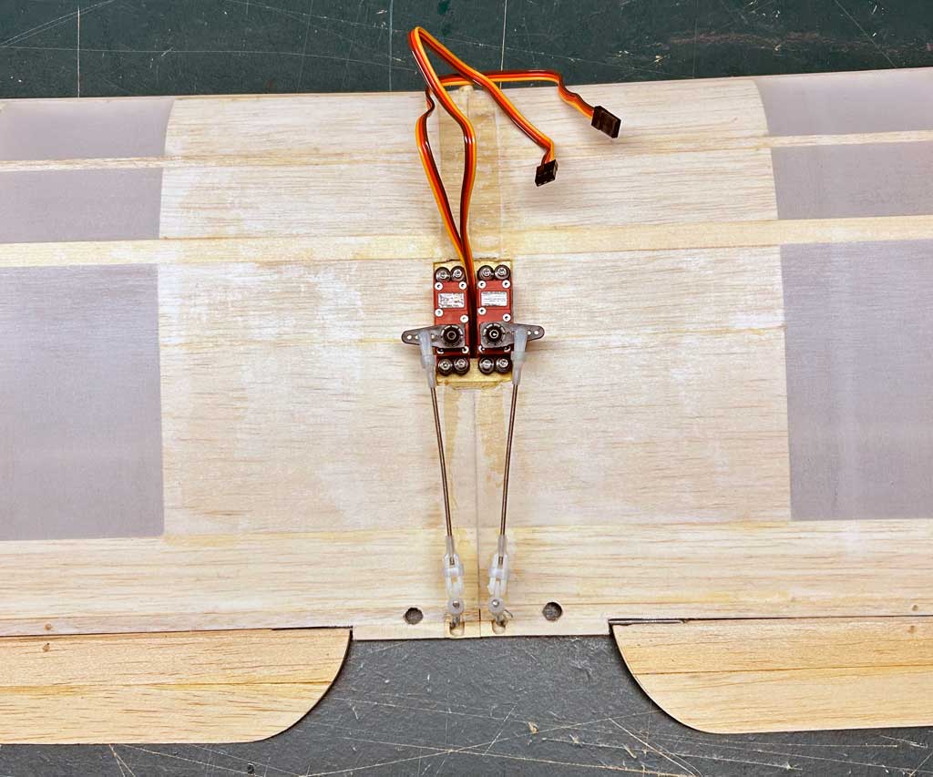 Close up of dual-servo aileron installation in a SIG Four-Star 40 wing.