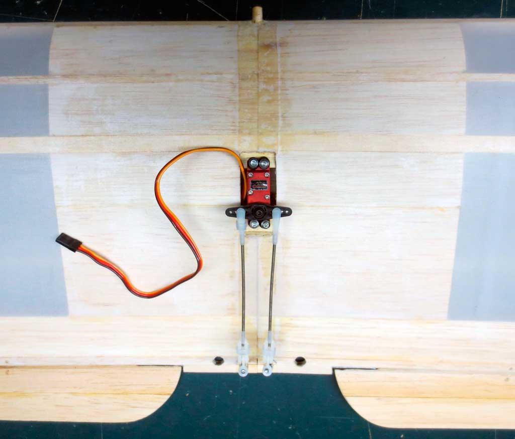 Close up of single-servo aileron installation in a SIG Four-Star 40 wing.