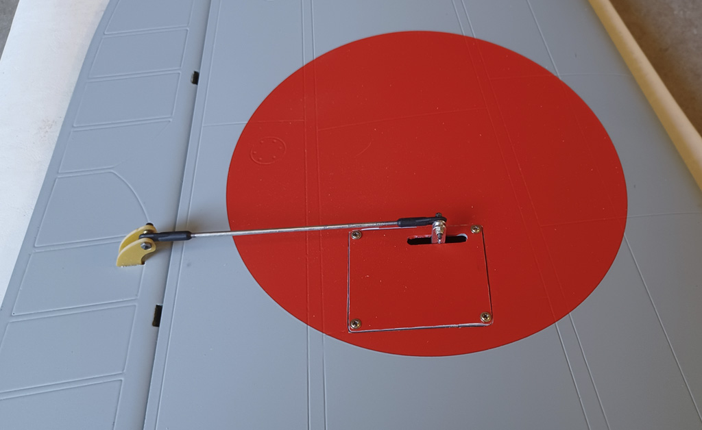 Close up photo of the aileron servo hatch on the underside of the TopRC Models 5th scale A6M5 Zero wing panel