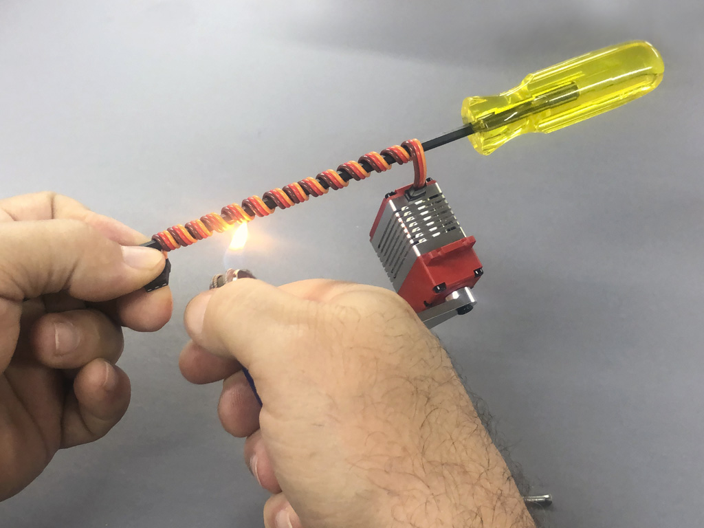 Photo of a ProModeler ProTip for how to coil a servo lead with a bit of heat