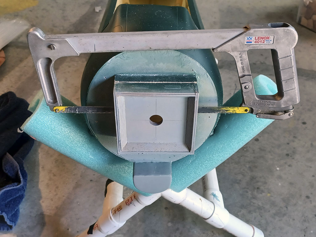 Close up photo of cutting the firewall for the Saito FG-90R3 engine instllation witihin the TopRC Models 5th scale A6M5 Zero