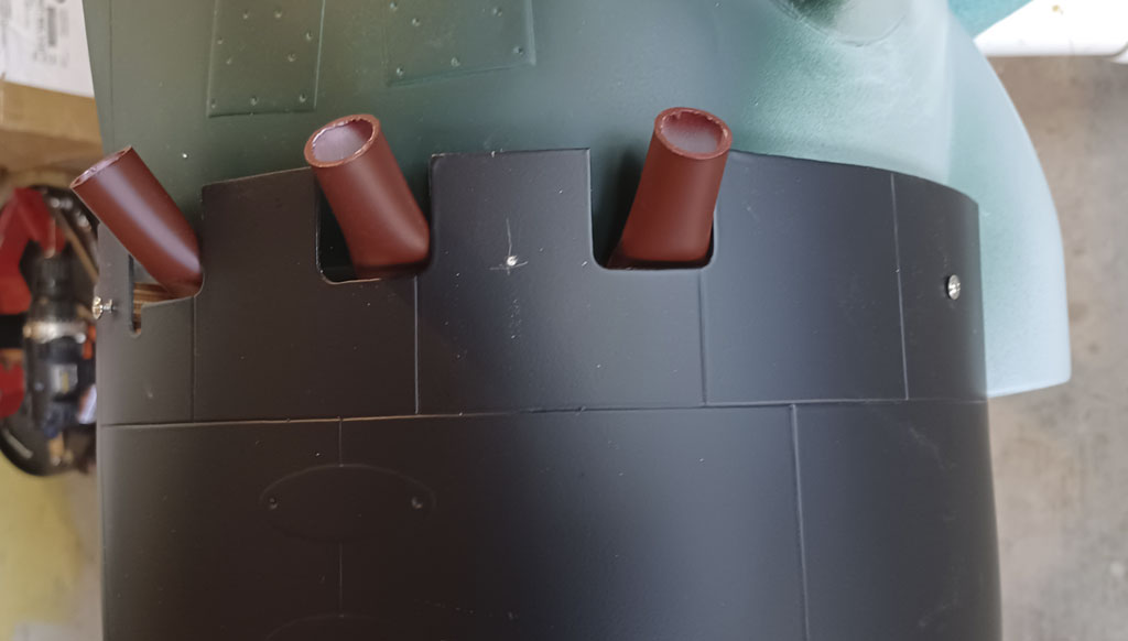 Close up photo of the simulated exhaust stubs for the TopRC Models 5th scale A6M5 Zero