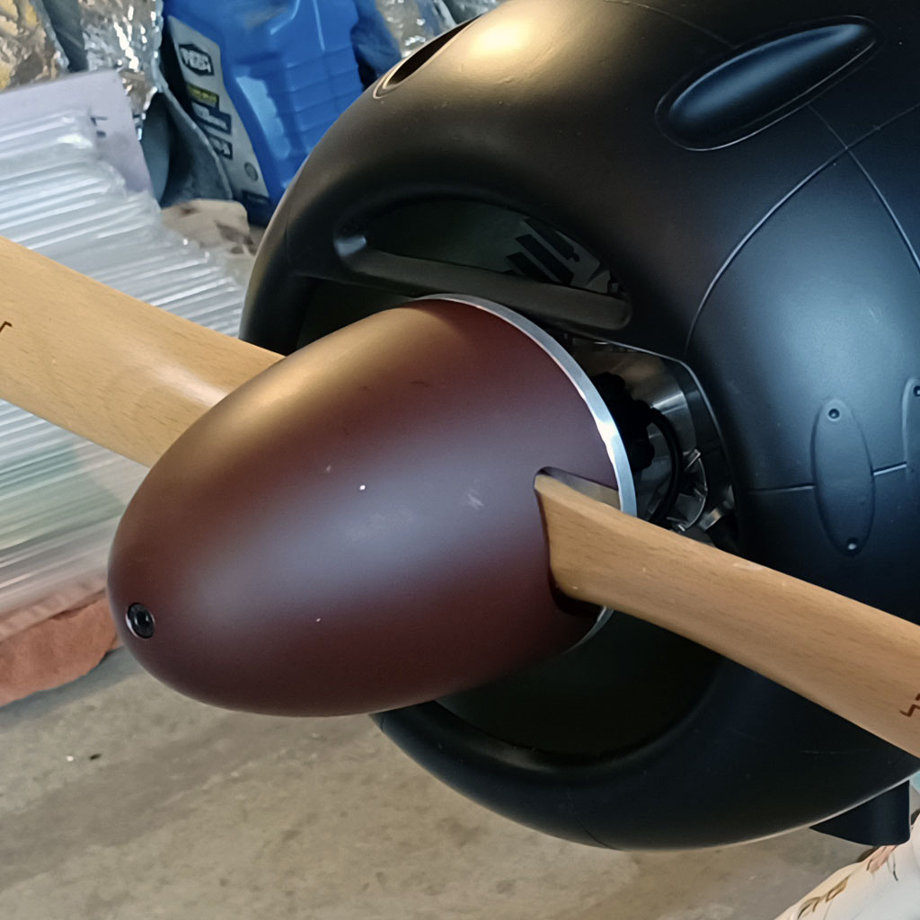 Close up photo of Saito FG-90R3 installed on the TTopRC Models 5th scale A6M5 with 2-blade prop and spinner