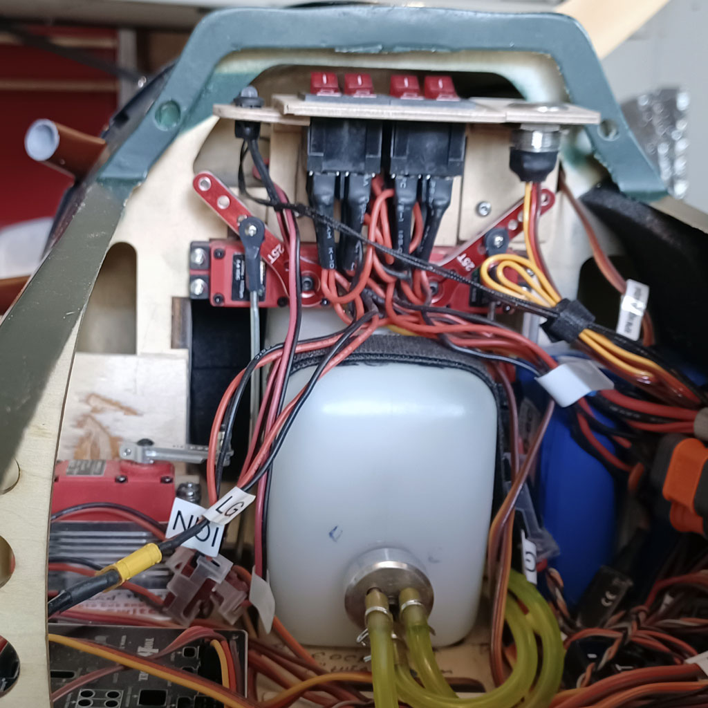 Cose up of the inner fuselage of the TopRC Models 5th scale A6M5 Zero shwoing the fuel tank and servos