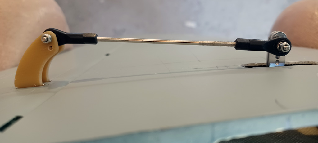 Close up photo of elevator linkage for the TopRC Models 5th scale A6M5 Zero horizontal stabs