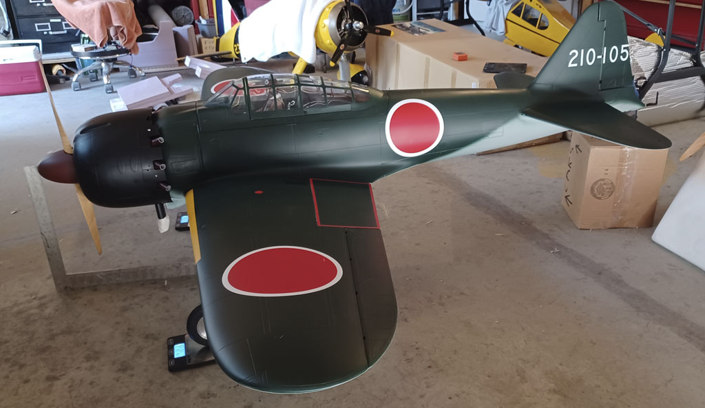 Wide angle photo of weighing the TopRC Models 5th scale A6M5 Zero model