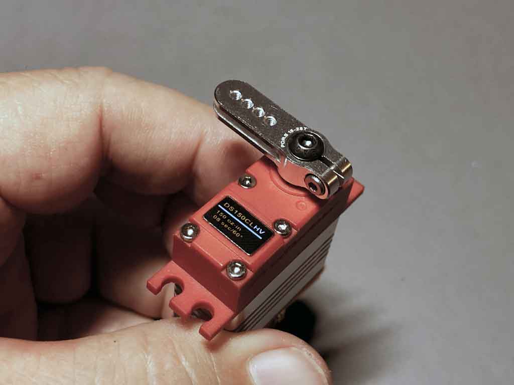 Close up of a ProModeler micro servo, the DS150CLHV equipped with H-beam profile PDRS15-25T servo horn machined of 7075-T6 aircraft aluminum and tapped M2.
