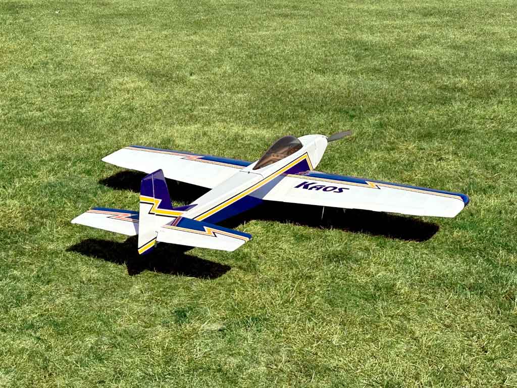 Aft view of of Dave Swanson's Tower Hobbies Kaos 60 against a grass backdrop.