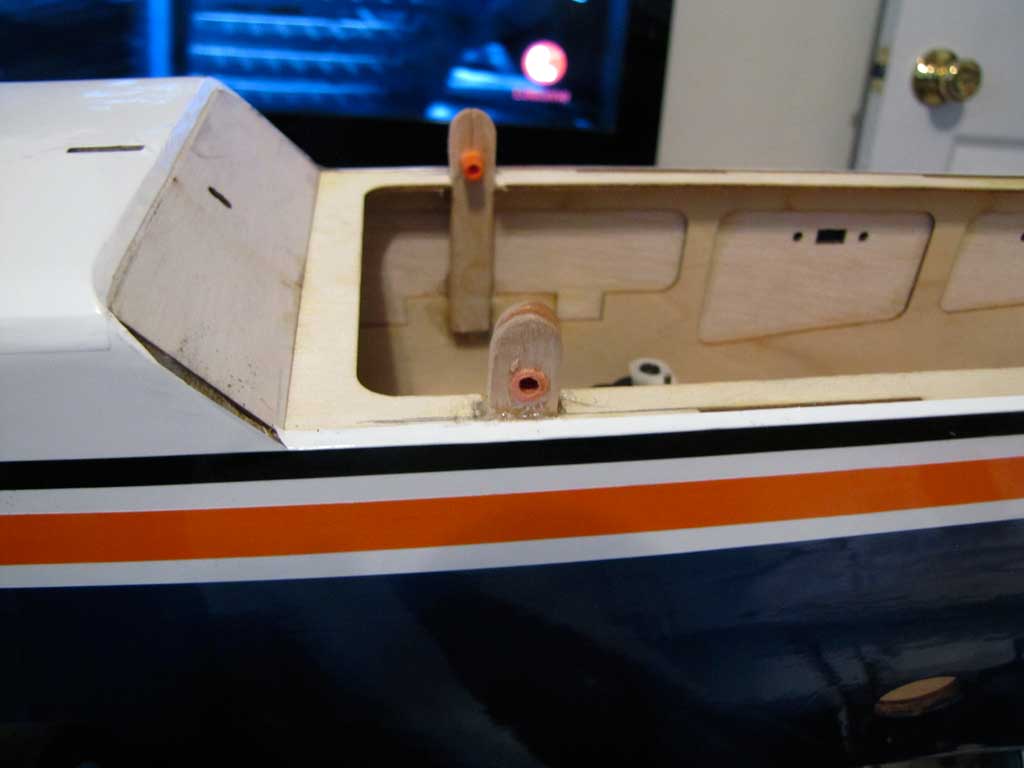 Wide shot of the smart use of Popsicle sticks and drywall anchors to secure the upper hatch of the Tower Hobbies 62in Kaos model.