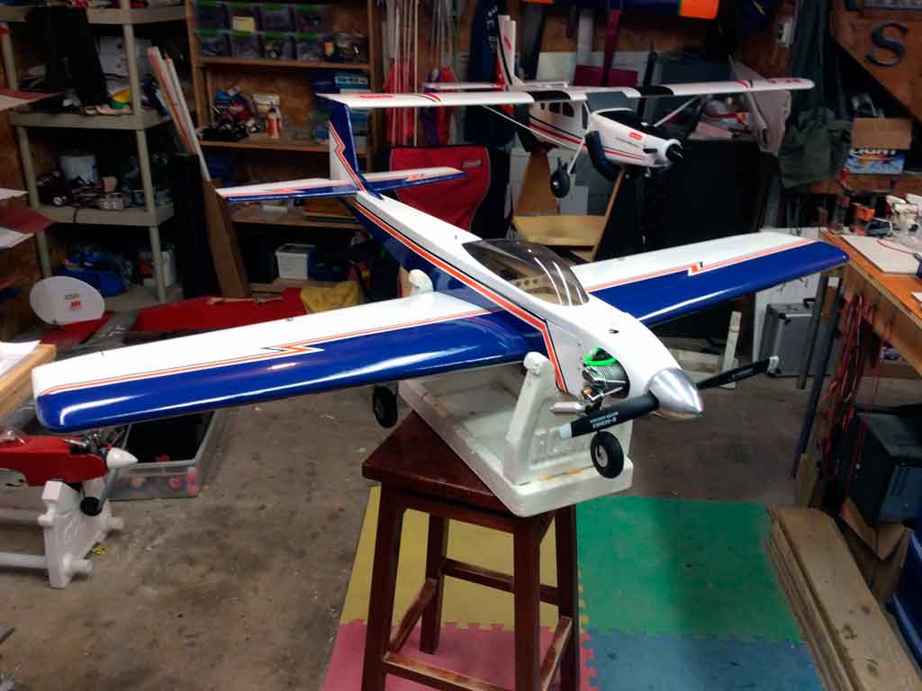 Close up of side mounting a Saito 100 four-stroke engine in a Tower Hobbies 62in Kaos.