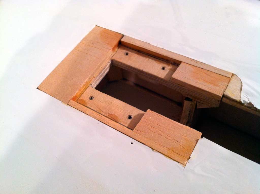 The bits of aircraft plywood once epoxied into the structure for the basis of the gear mount.