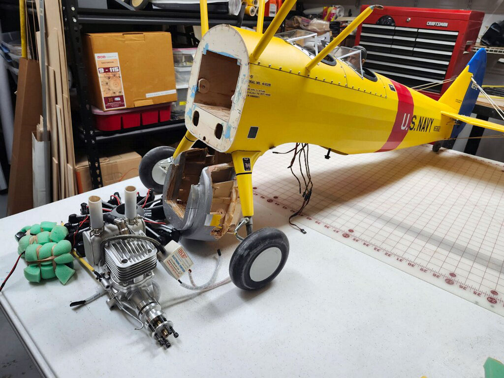 Wide angle photo of the Stearman fuselage and all the bits and bobs removed from the structure before making the start to the UMS radial engine conversion