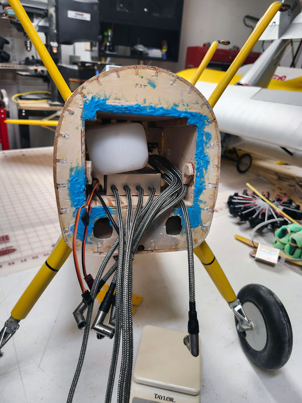 Close up photo of F3 after removing old firewall from Ziroli Stearman showing blue SuperFill wood filler