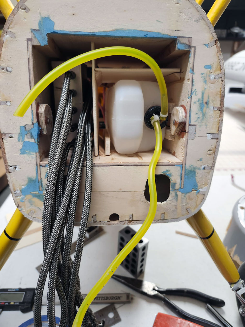 Close up photo showing the lite ply dividers in place along with ignition module and 20 ounce DuBro fuel tank