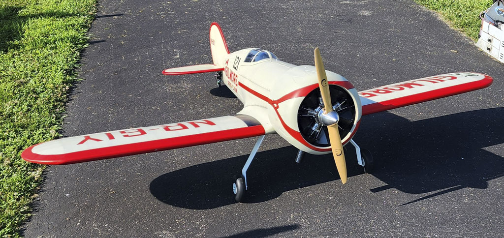 Flying field photo of Robert Dochterman's Black Horse models 96 inch wingspan Gilmore powered by a UMS 5 100 radial engine