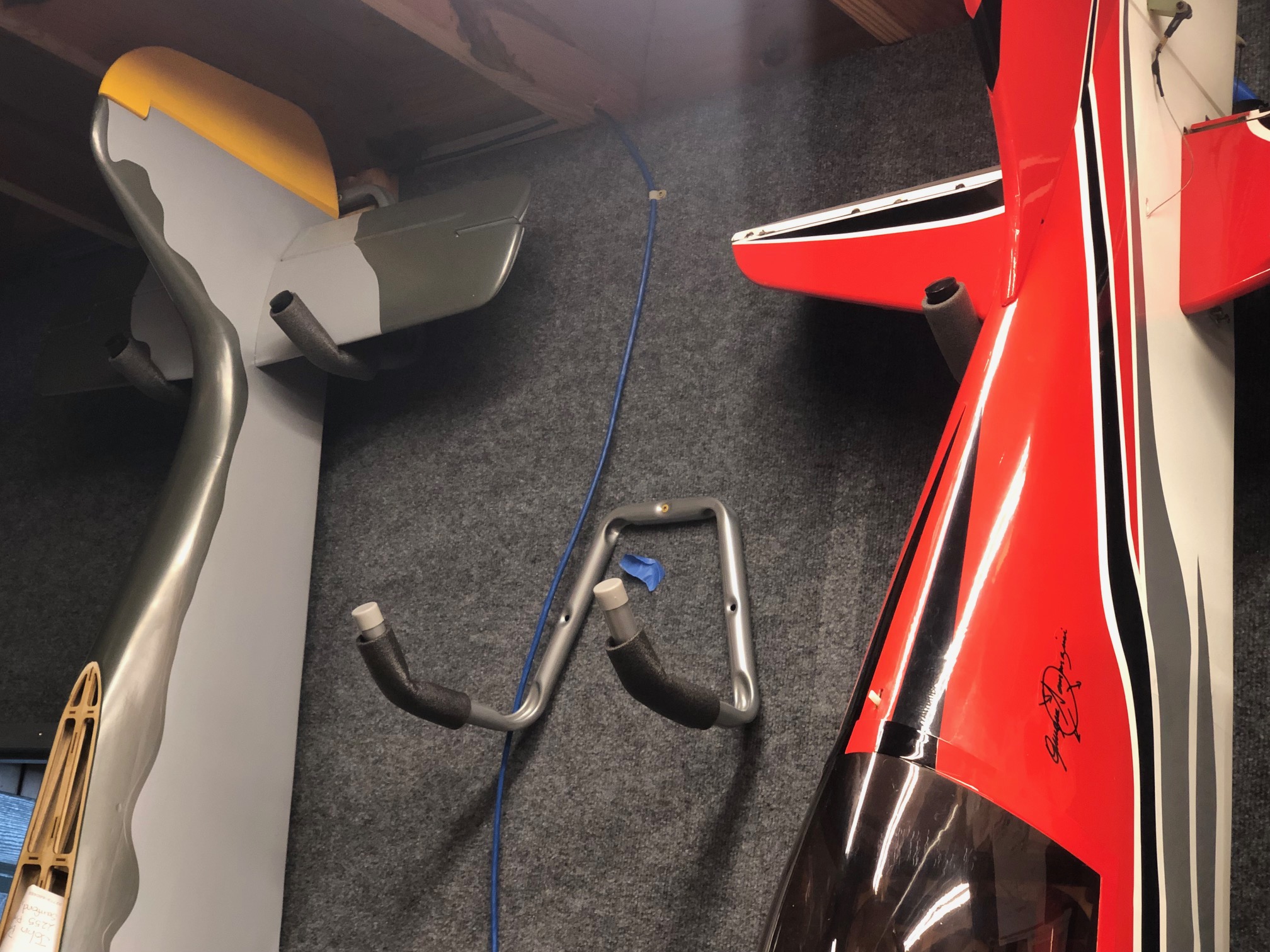 Close up of wall mounted padded tail hooks