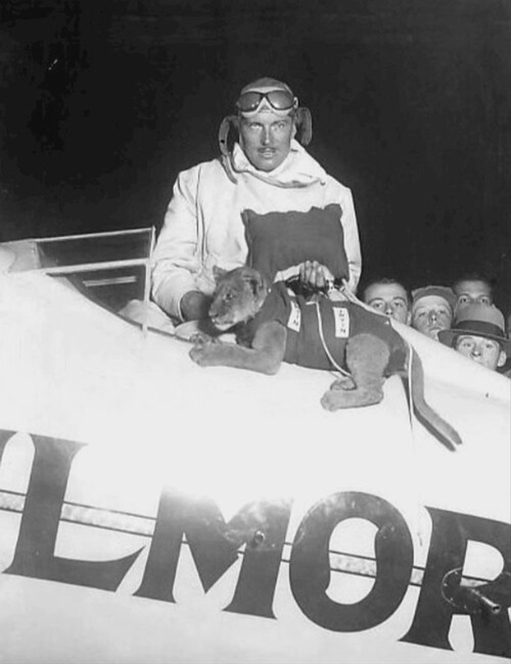 Close up black and white photo of Roscoe Turner and Gilmore as a cub within the Gilmore air racer cockpit