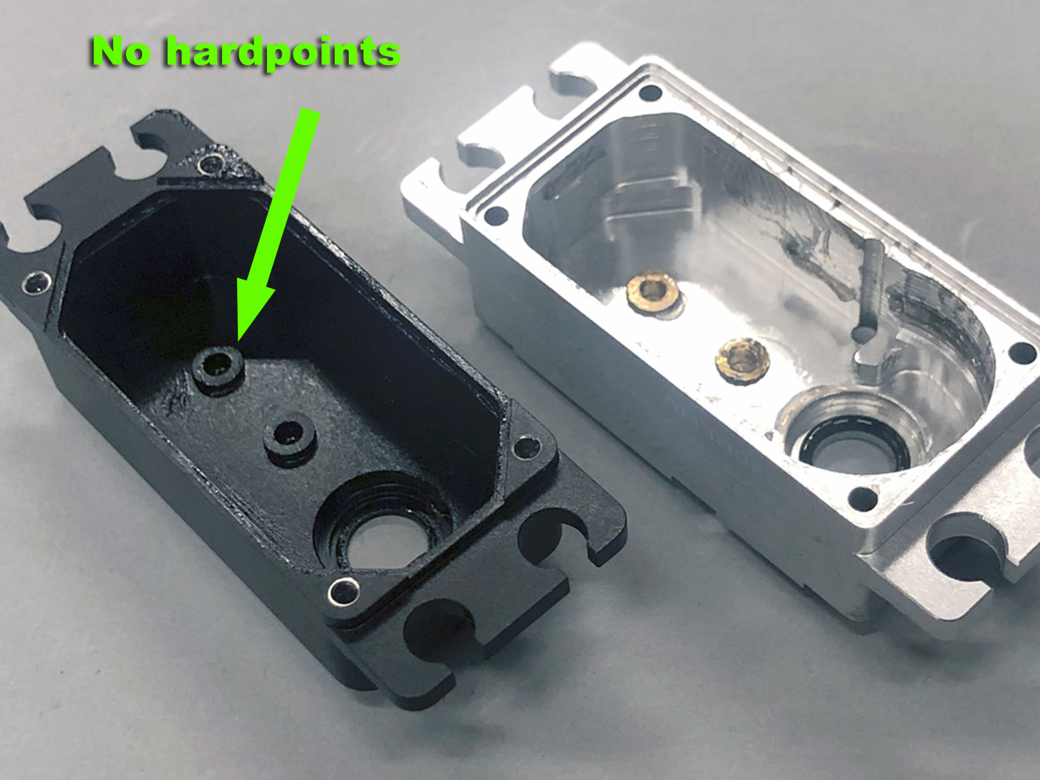 Close up photo showing SAVOX servo does not have hardpoint inserts whilst ProModeler does have hardpoints