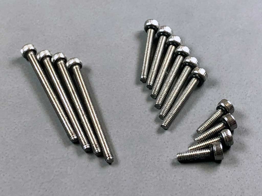 Close up of stainless steel M2 machine thread Allen head bolts, four long ones for AccuTORQ 600SG versus ten shorter ones with o-rings for the ProModeler DS630BLHV.