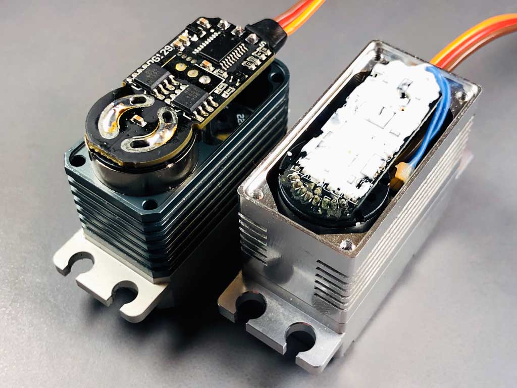 The white stuff on the PCB components is called potting compound and this is why the ProModeler meets MIL-STDS for shock and vibration.