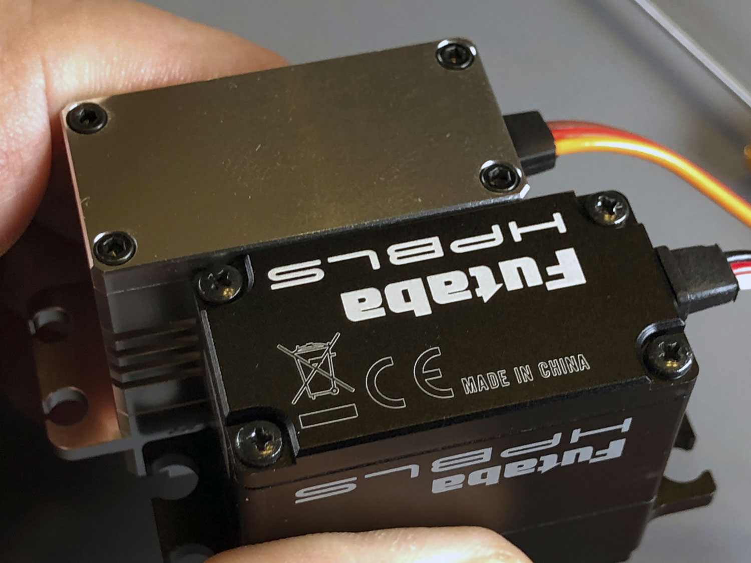 Close up photo of Futaba vs ProModeler showcasing the text and anodize treatment displaying branding and model number