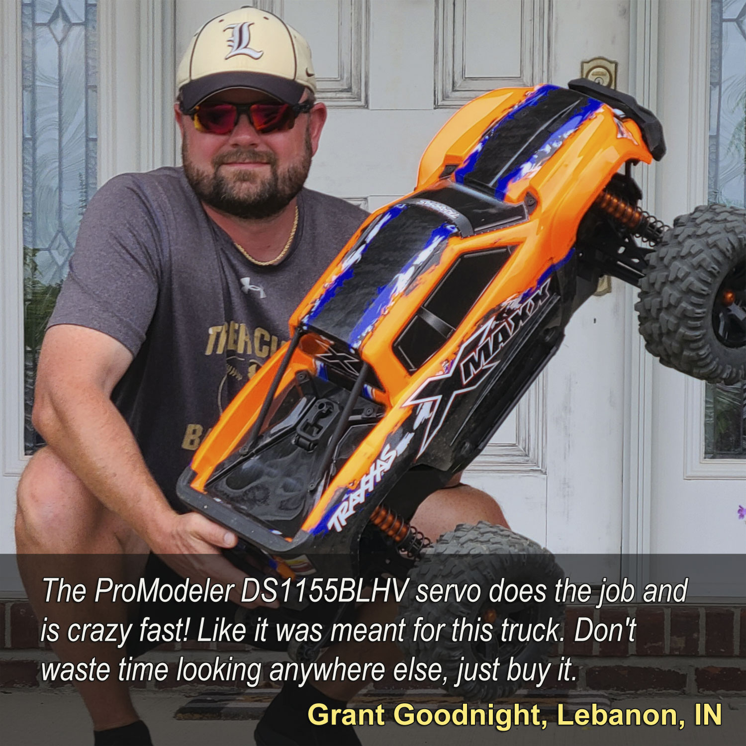 Close up of Grant Goodnight holding his Traxxas X-Maxx equipped with ProModeler DS1155BLHV servo for steering